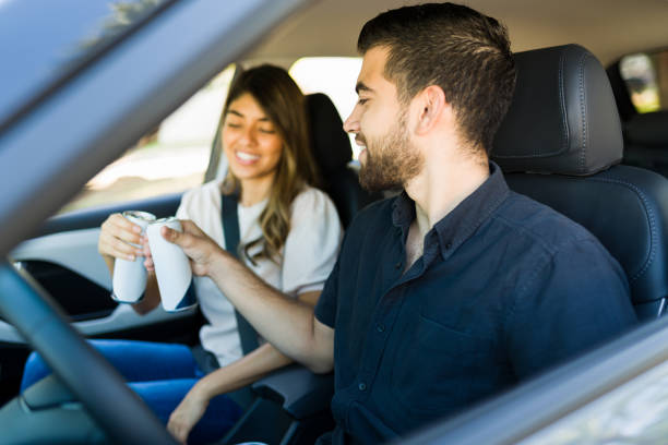 istock Boyfriend and girlfriend with snacks on a road trip 1354258855