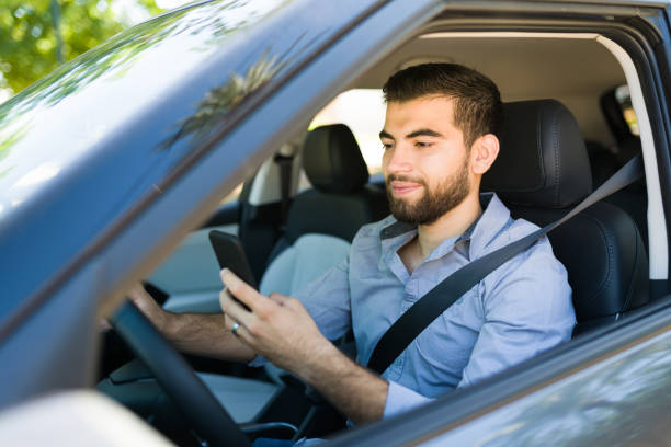 istock Cheerful young man driving home 1354259321
