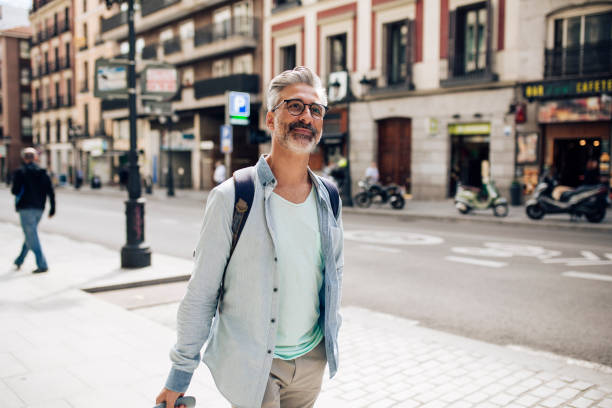 istock Mature tourist arriving to Madrid 1354260404