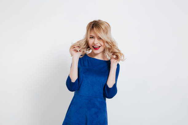 istock Amazing young lady standing over white background. 1354262293