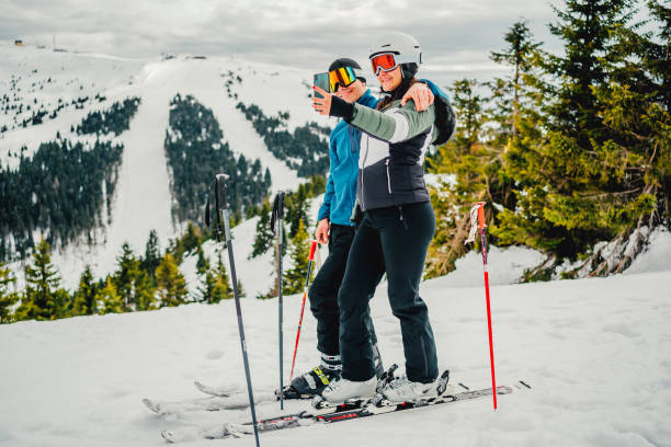 istock Ski couple taking selfie 1354262307