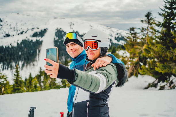 istock Ski couple taking selfie 1354262419