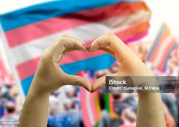 Hands Making Hear Shape Over Transgender Flag In Background Stock Photo - Download Image Now