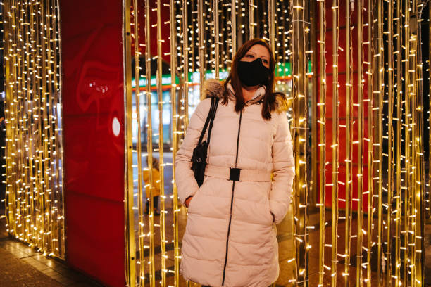 istock Woman among Christmas lights 1354263181
