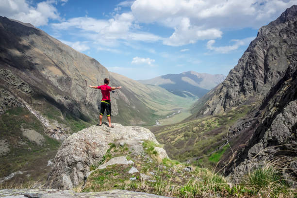 Hiker in the mountains overlooking the Midagrabin valley