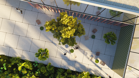 Overhead view of a green outdoor area of a modern building. All objects in the scene are 3D