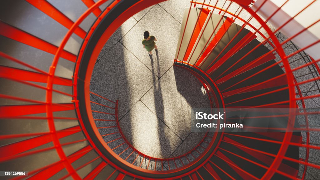 Office building staircase Overhead view from the top of a red staircase in a modern office building. All objects in the scene are 3D Aerial View Stock Photo