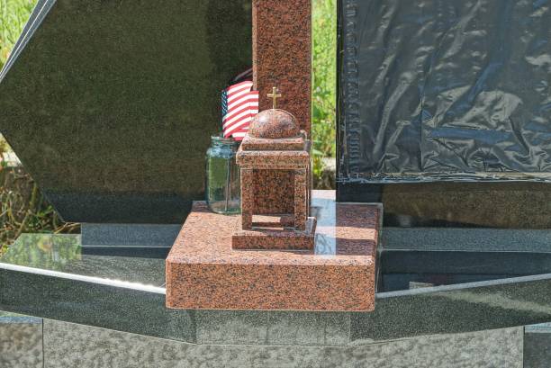 istock one brown marble lamp stands on a gray granite gravestone 1354271778