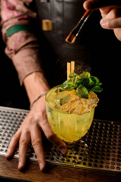 istock glass with bright cocktail decorated with mint accurate sprinkled with powder 1354276342