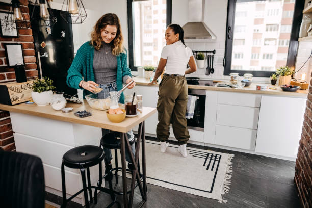 istock Couple making pancakes at home. 1354279861