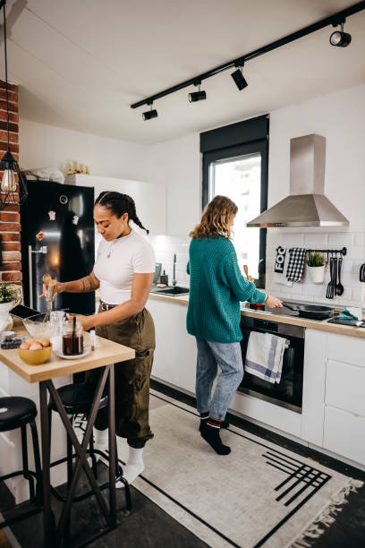 istock Couple making pancakes at home. 1354279878