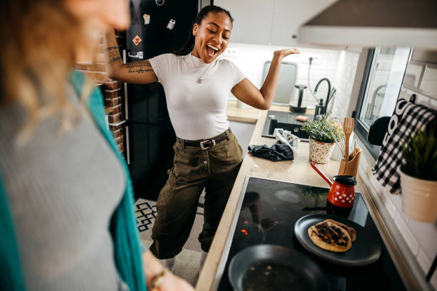 istock Couple making pancakes at home. 1354281509