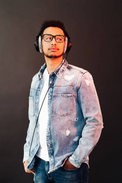 istock Carefree dark skinned guy listens lively music 1354283868