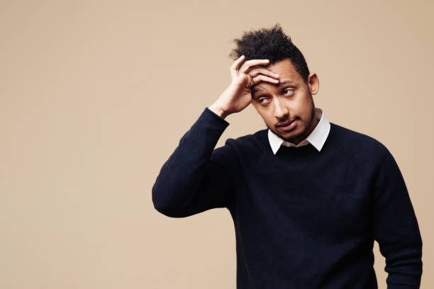 istock Migraine, health problem, pain face, stress work, suffer, emotion, headach, frustrated afro man 1354285178