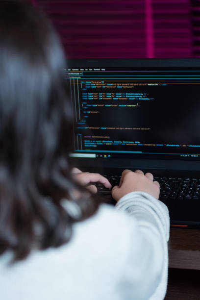 Teenage girl writing code to program a web application. Vertical image of a teenage girl writing code to program a web application. cascading style sheets photos stock pictures, royalty-free photos & images