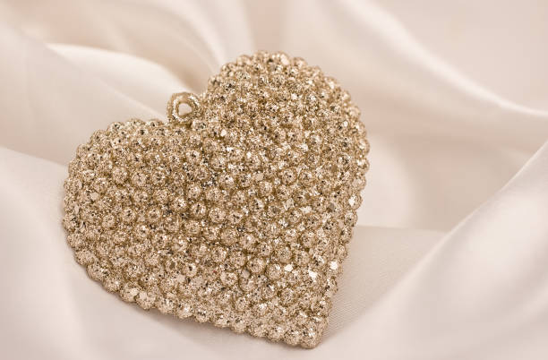 istock gold heart decoration on white background 1354288234