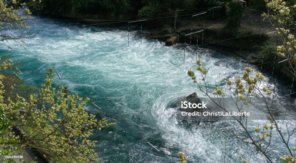 Fast flowing water at the Fontaine de Vaucluse Fresh aquamarine water Beauty Stock Photo
