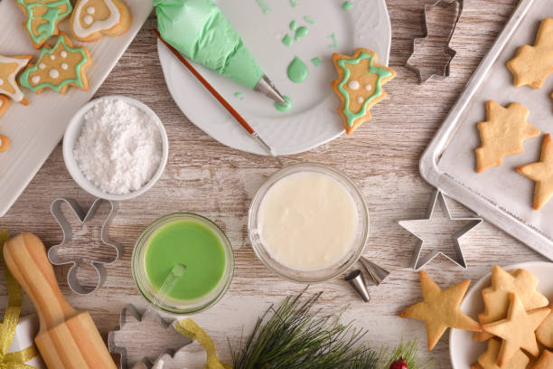istock Detail decorating Christmas themed cookies with colored icing top 1354295373