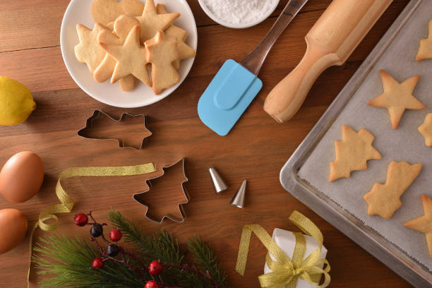istock Table with freshly baked Christmas cookies with molds and utensils 1354295401