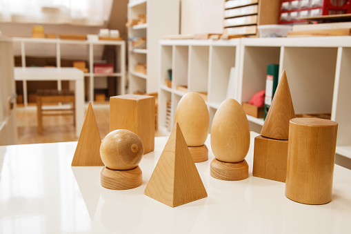 Wooden geometric shapes in montessori class