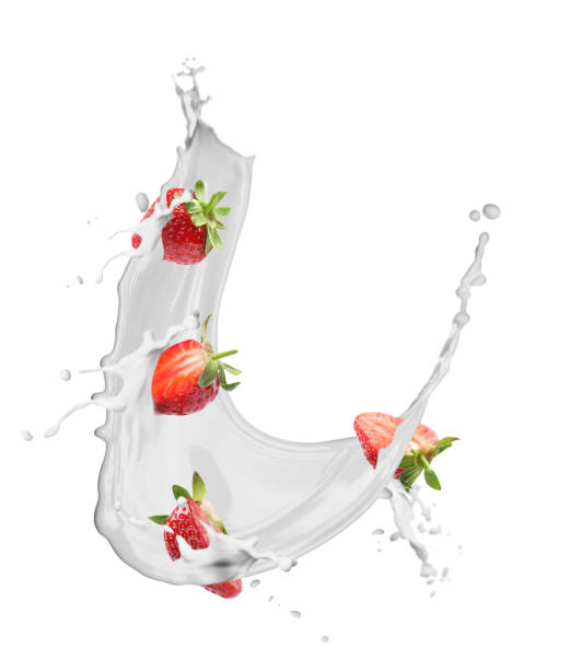 istock Fresh strawberries with milk splash on white background 1354302756