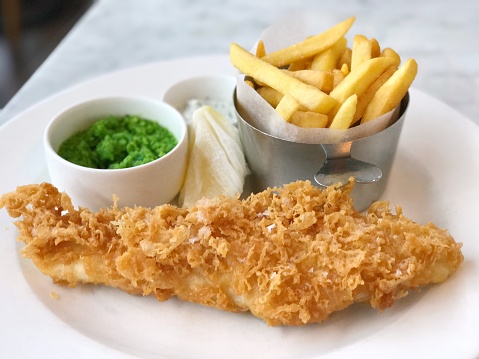 Traditional fish chips and mushy peas