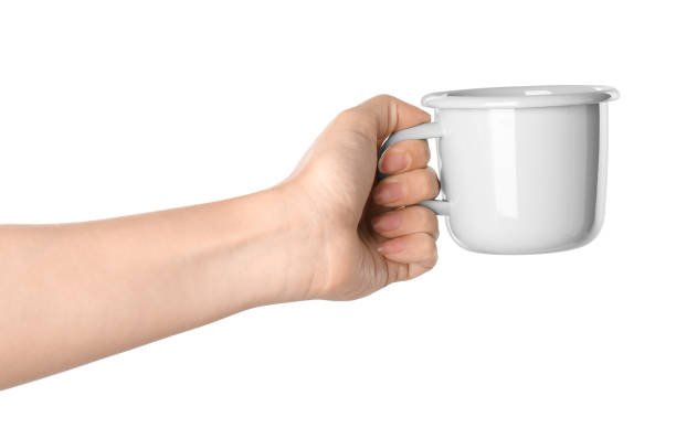 istock Woman holding light grey cup on white background, closeup 1354303151
