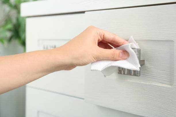 istock Woman using tissue paper to open drawer, closeup 1354305489