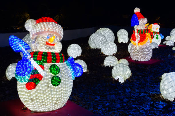 istock Snowman illuminated with colors.  Christmas decoration 1354306422