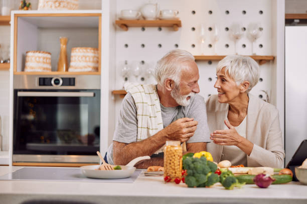 istock a happy senior couple preparing a healthy meal together, using a tablet 1354307521
