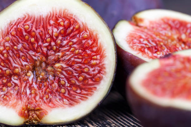 istock ripe purple figs on a wooden table 1354307717