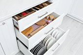 istock Open drawers with cutlery and utensils indoors. Order in kitchen 1354308827
