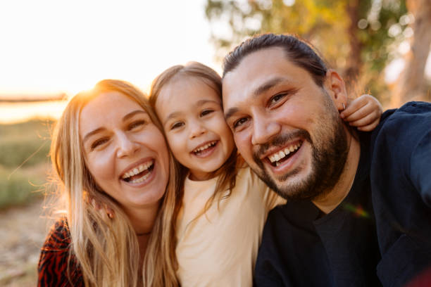 istock Happy family in nature at sunset 1354308926