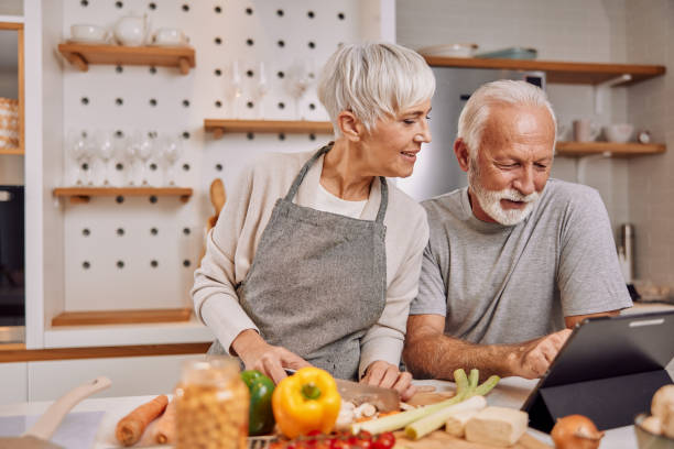 istock a happy senior couple preparing a healthy meal together, using a tablet 1354309162