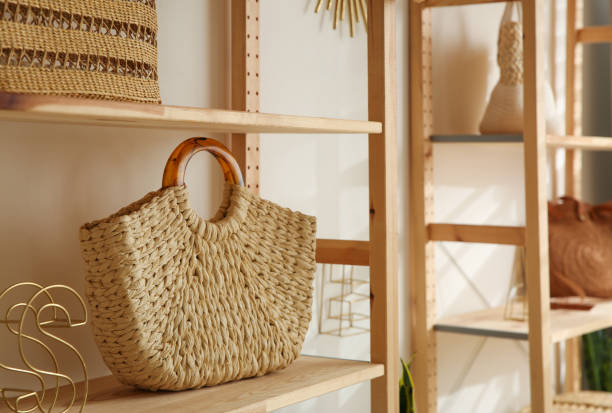 istock Stylish woman's bag on shelf in boutique 1354309972