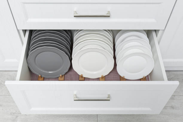 istock Open drawer with clean plates indoors. Order in kitchen 1354310402