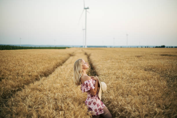 istock young woman in wheat field 1354310537