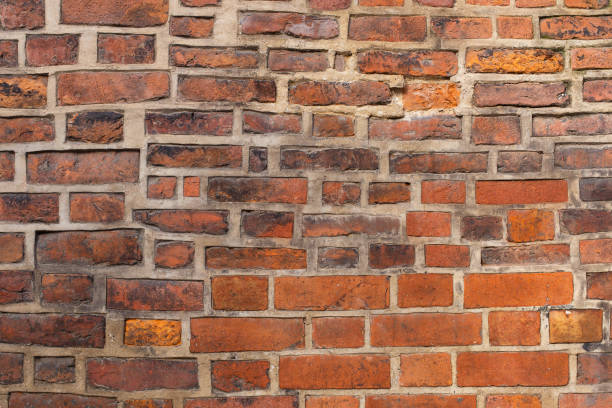 istock Ancient old city yellow orange red brick wall 1354310541