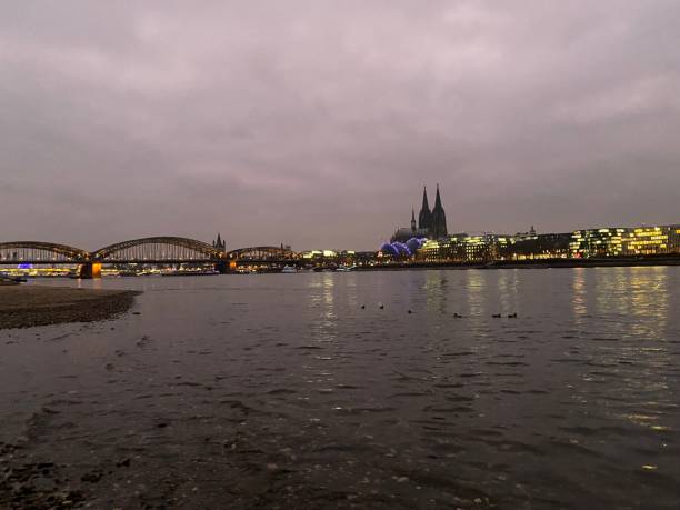 istock Cologne Cathedral and Cologne Rhine panorama illuminated at dusk 1354312700