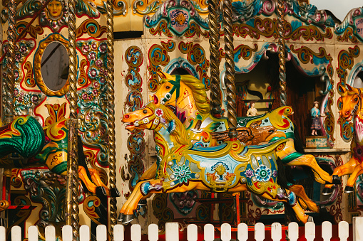 Close up of carousel horses at the fun fair.
