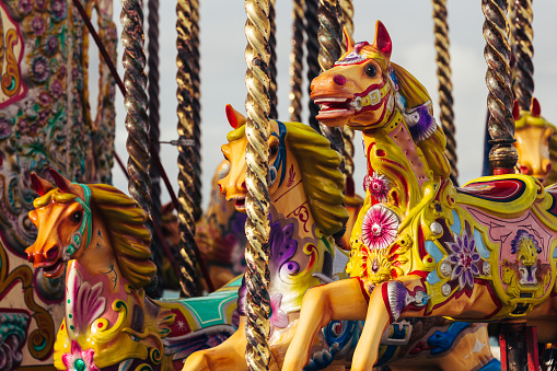 Christmas fair, traditional fair carousel with lights blurred background