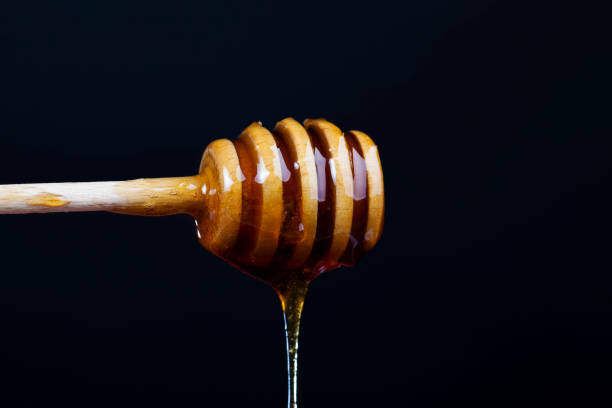 istock current thick and delicious sweet honey, close up 1354314576