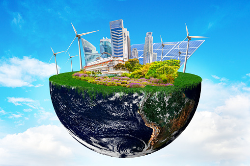 Planet earth with clean nature city relying on renewable resources. Concept of sustainable ecological future and alternative energy of an eco friendly planet. Elements of this image furnished by NASA imagery https://earthobservatory.nasa.gov/images/885/earth-from-space