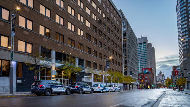 montreal police vehicles waiting to depart from spvm headquarters - depart imagens e fotografias de stock