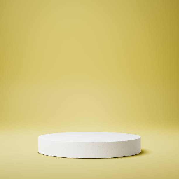 istock White Cylindrical Product Display Stage on Yellow Background 1354328120