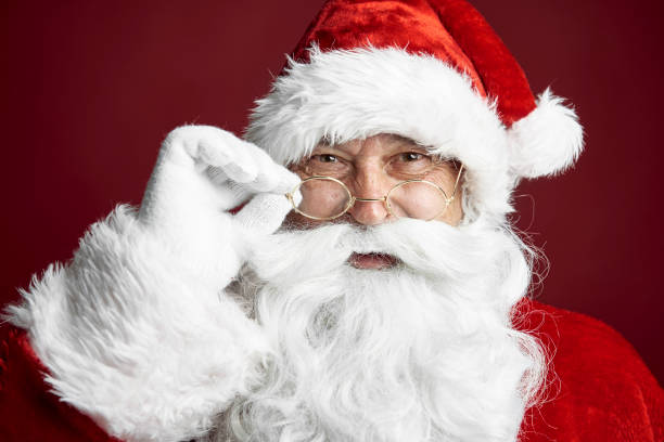 Close up of Santa Claus on the red background stock photo