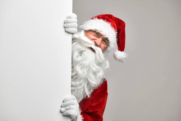 istock Caucasian Santa Claus with white blackboard 1354329637