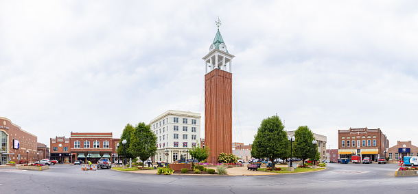 Marion, Illinois, USA - August 18, 2021: The Clock Tower at the Old Town Square, surrounded by old historic buildings