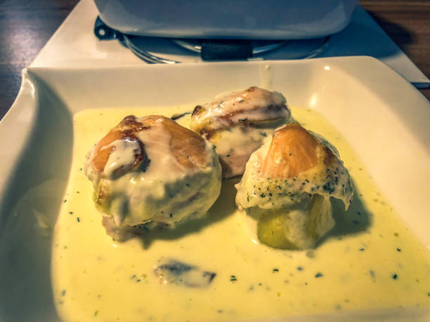 istock Potatoes with fish fillet in a light sauce. 1354329925