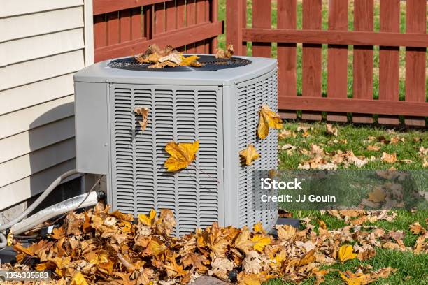 Dirty Air Conditioning Unit Covered In Leaves During Autumn Home Air Conditioning Hvac Repair Service Fall Cleaning And Maintenance Stock Photo - Download Image Now